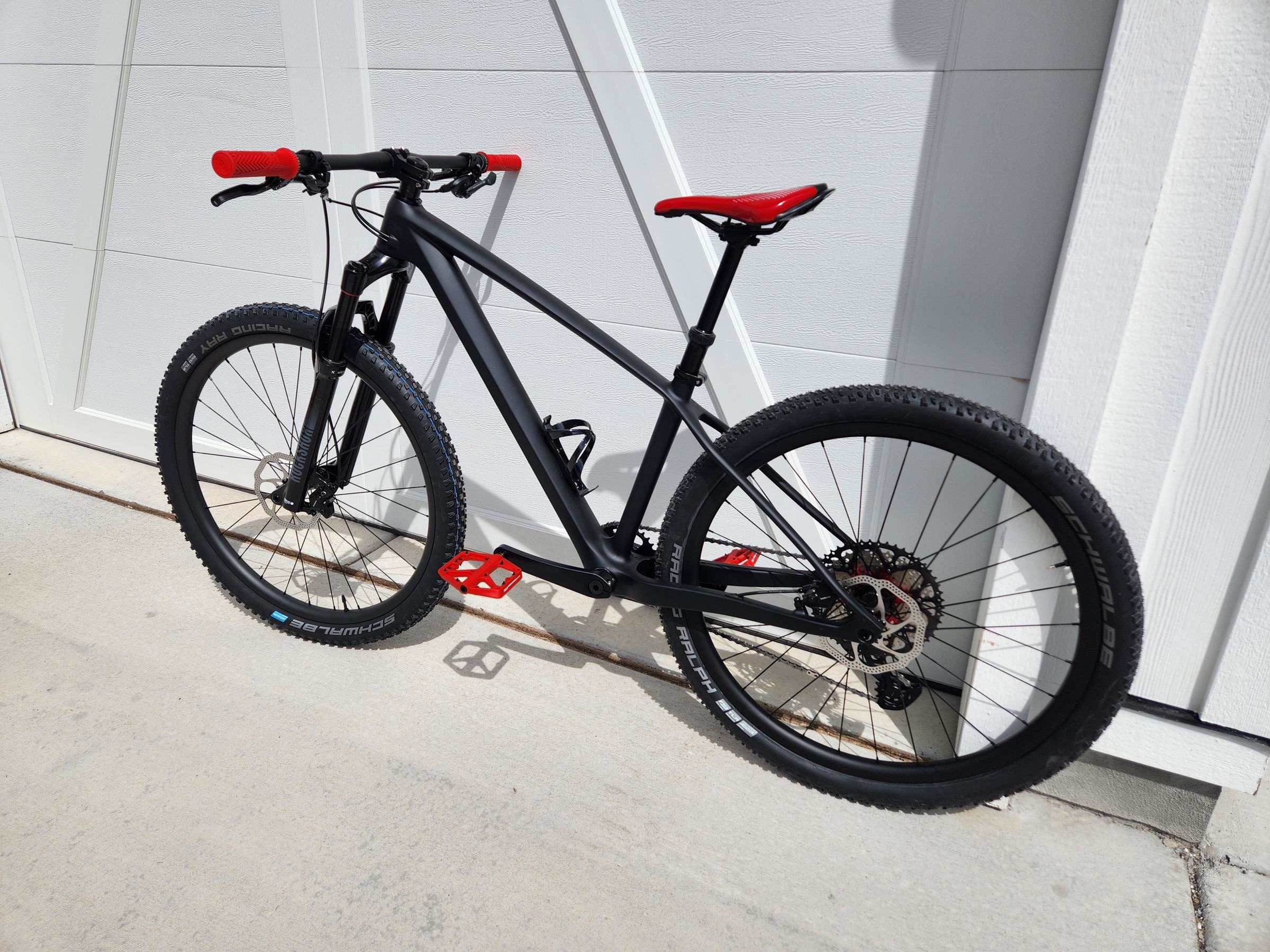 Crest carbon hardtail with red contact-point accents