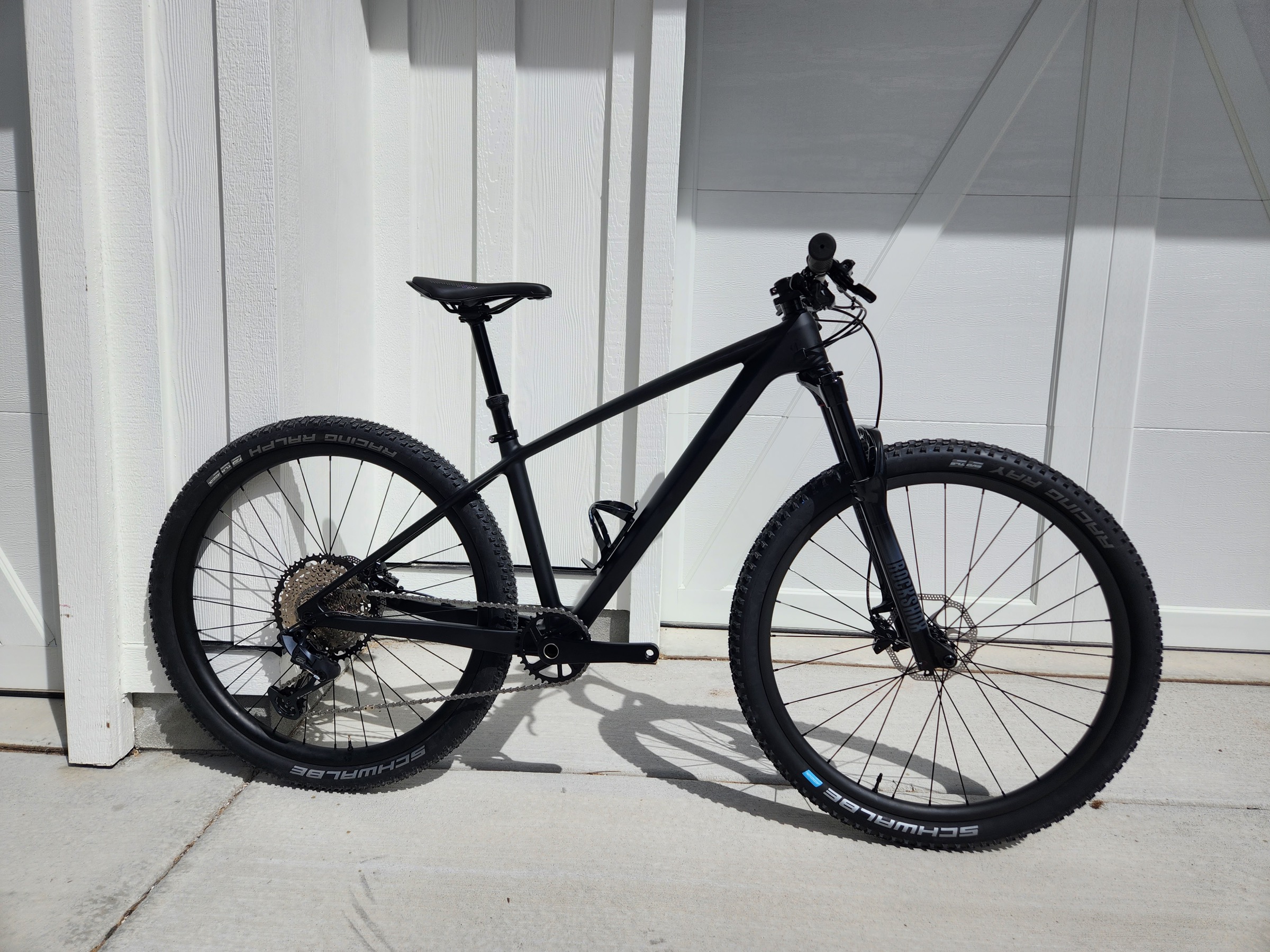 Matte black Crest carbon hardtail shown from the drive side